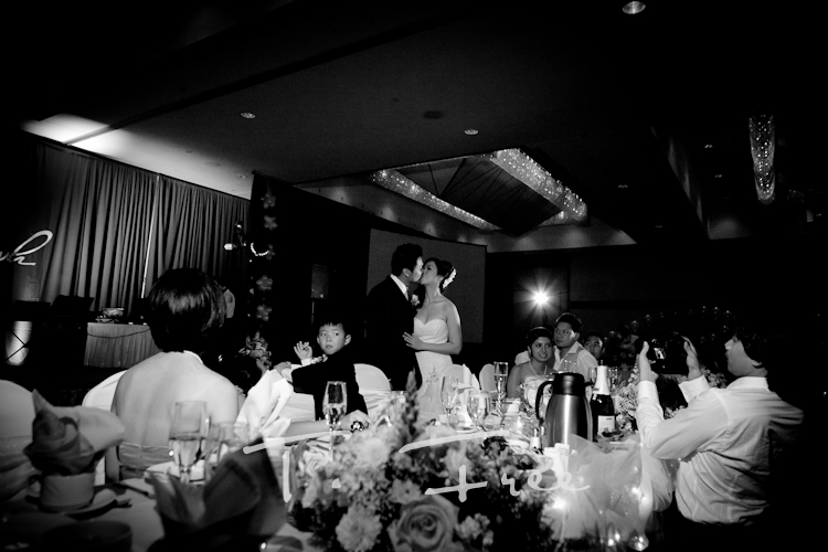 Black and white first kiss wedding reception image in Omaha Nebraska.