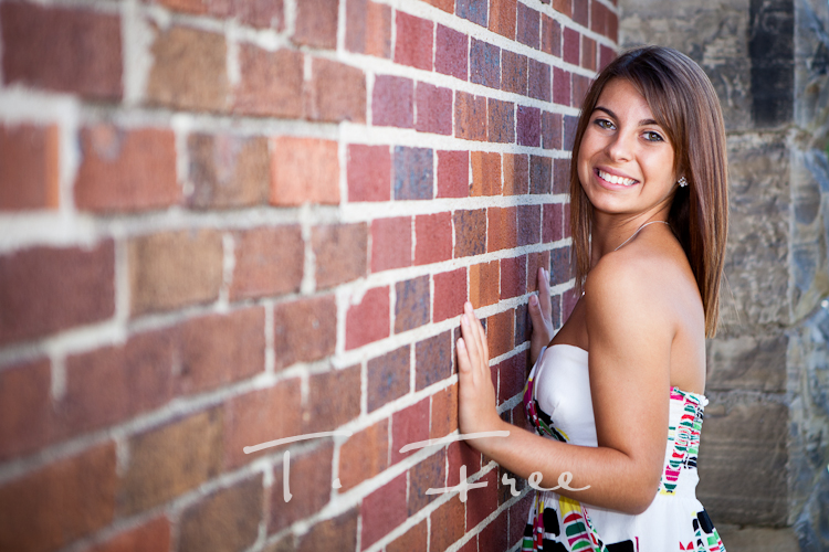 Omaha Nebraska senior girl picture against a brick wall.
