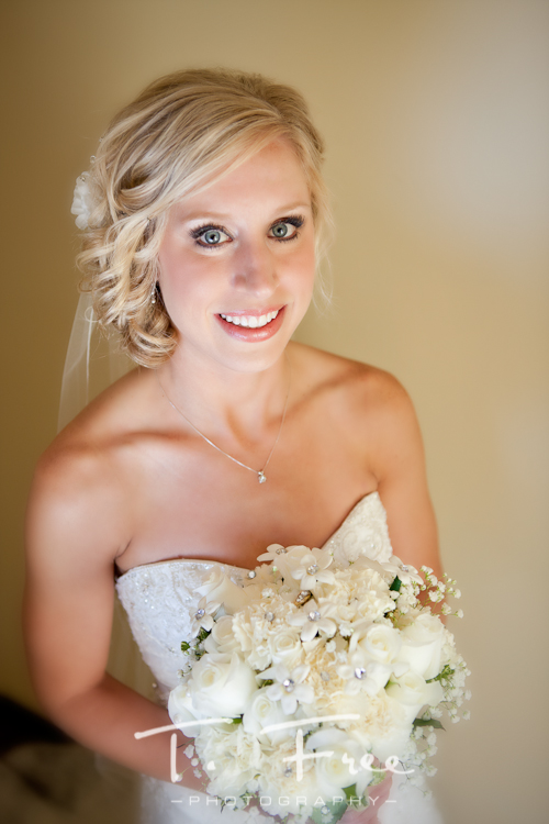 Beautiful close up image of bride holding her flowers at Holdrege, Nebraska wedding.