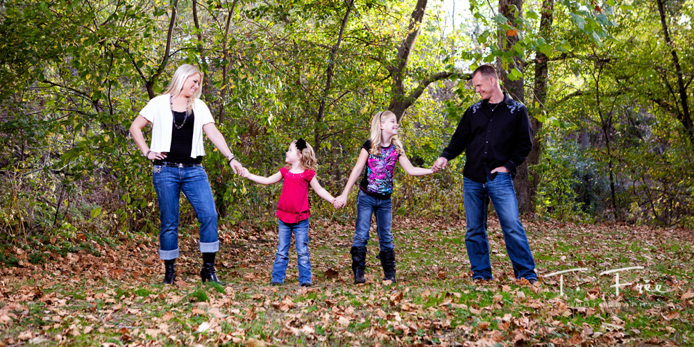 Cool unique outdoor fall family photo session taken at Elmwood Park in Omaha.